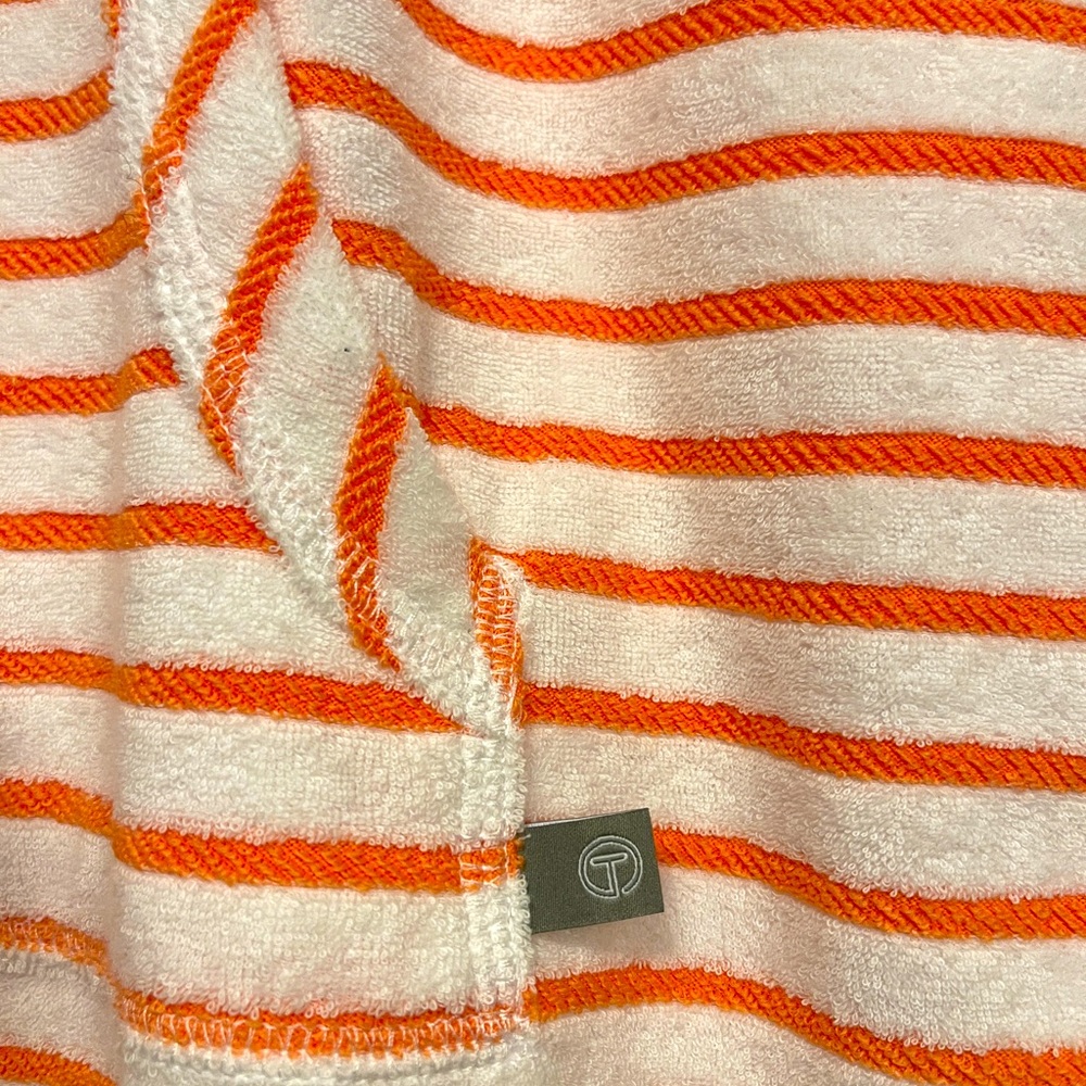 Women Sports Talbot in strip  orange shirt with a hoodie.